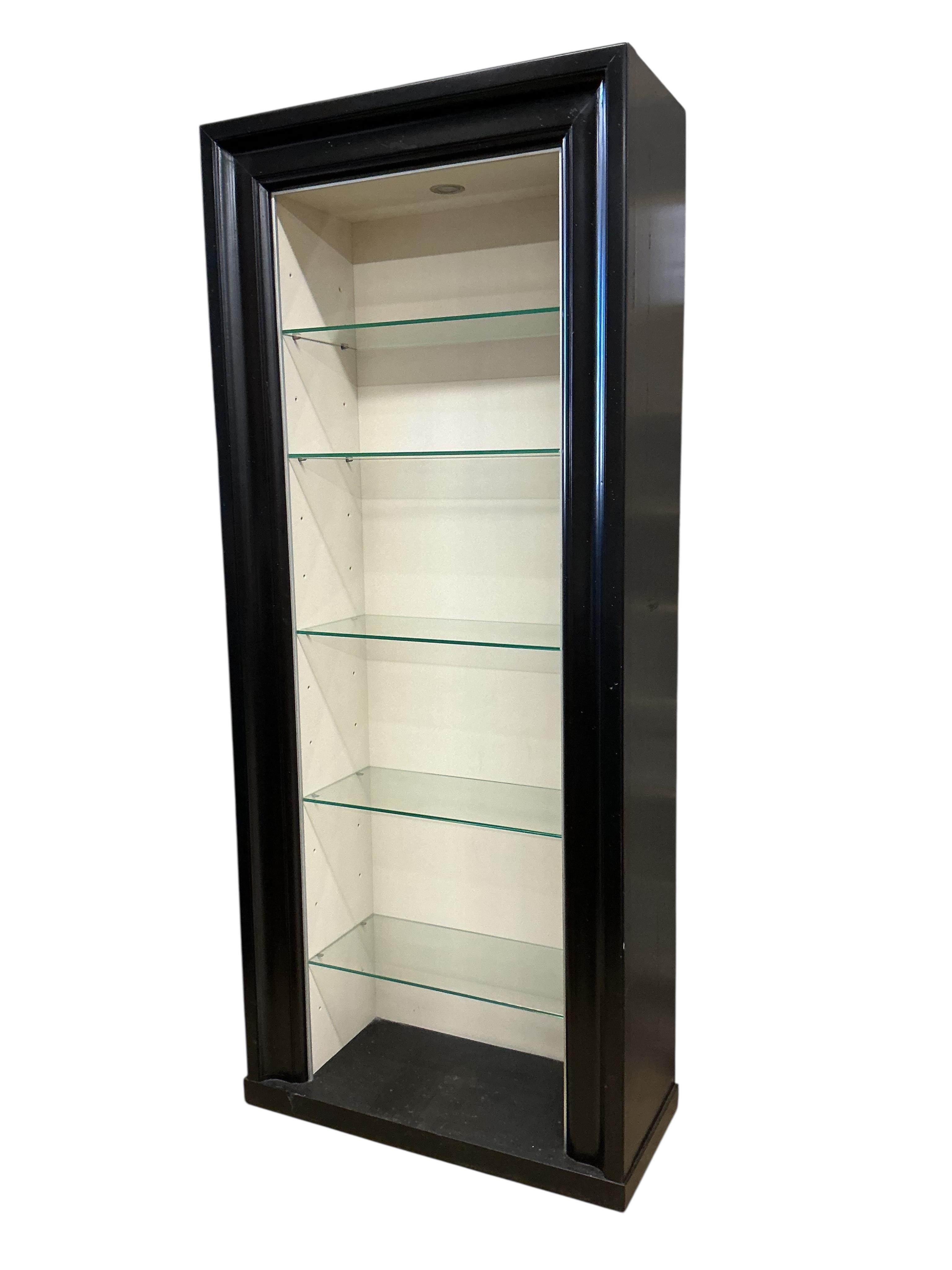 A pair of contemporary ebonised open display units, width 92cm, depth 39cm, height 217cm